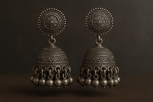 Traditional oxidized jhumkas with ghungroo detailing. Lightweight and handmade.