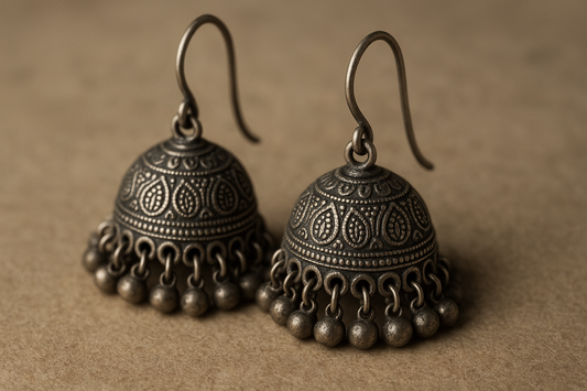 Traditional oxidized jhumkas with ghungroo detailing. Lightweight and handmade.