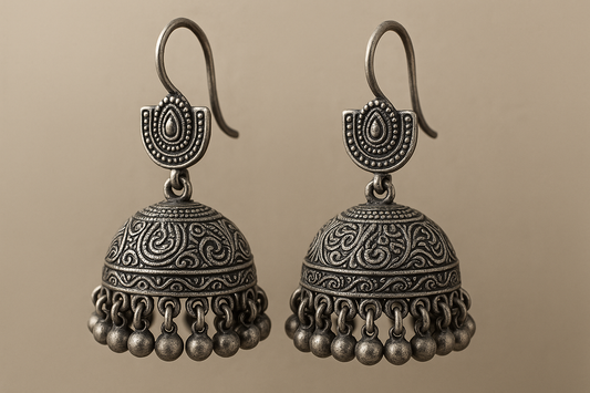 Traditional oxidized jhumkas with ghungroo detailing. Lightweight and handmade.