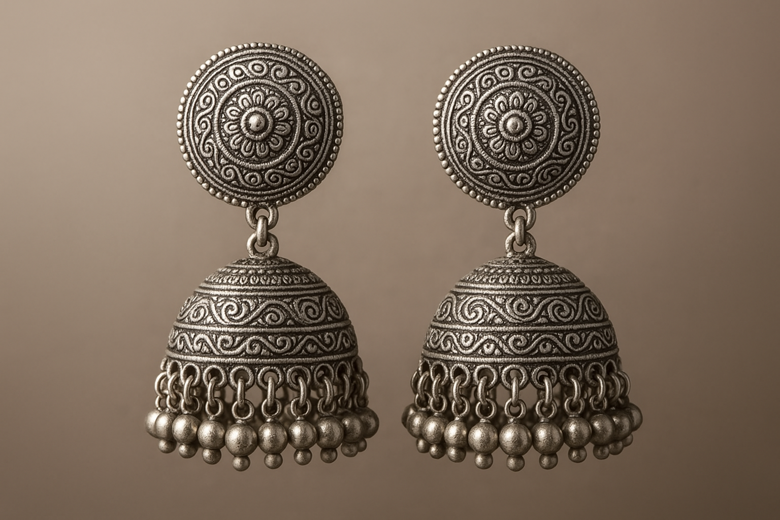 Traditional oxidized jhumkas with ghungroo detailing. Lightweight and handmade.