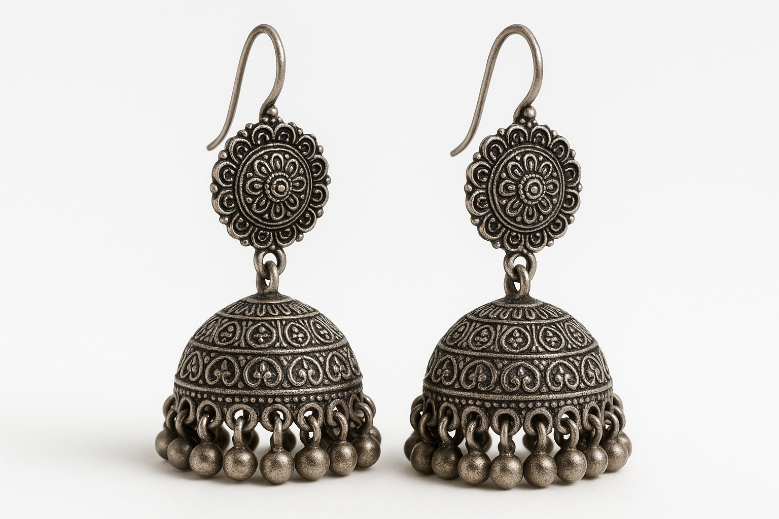 Traditional oxidized jhumkas with ghungroo detailing. Lightweight and handmade.