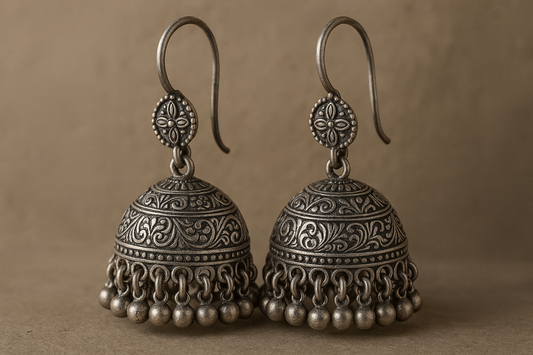 Traditional oxidized jhumkas with ghungroo detailing. Lightweight and handmade.