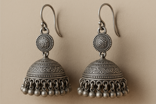 Traditional oxidized jhumkas with ghungroo detailing. Lightweight and handmade.